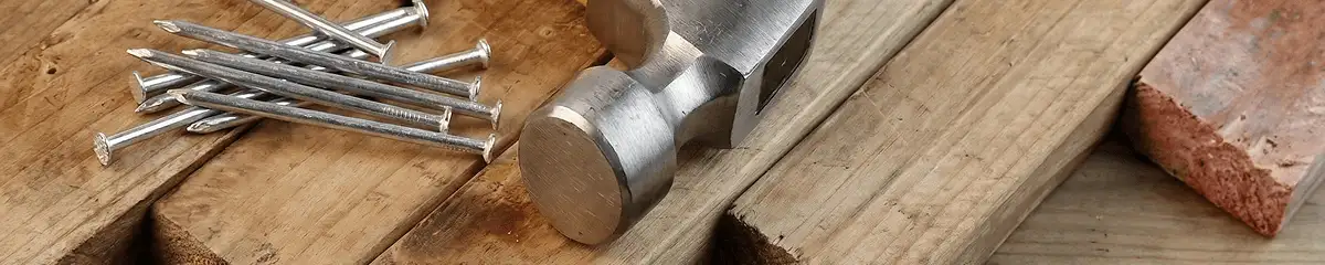 Hammer and nails on hardwood flooring boards in Hialeah, FL