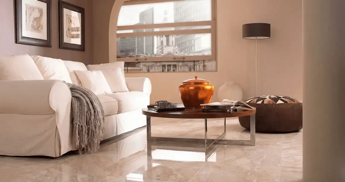 Modern living room with professionally installed marble flooring, a beige sofa, coffee table in Hialeah, FL