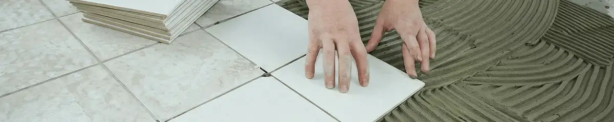 Professional installing white tile floors in Hialeah, FL