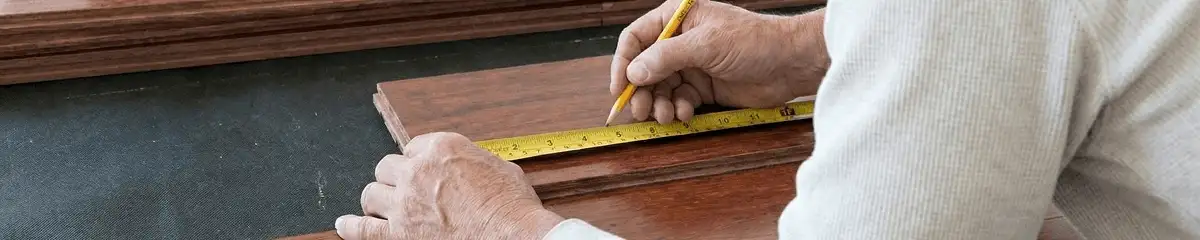 A professional installing wood flooring in Hialeah, FL